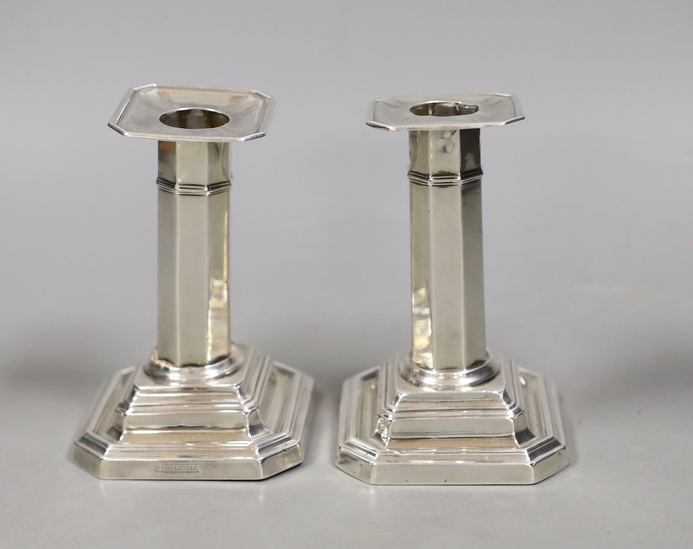 A pair of Edwardian silver dwarf candlesticks, James Dixon & Sons Sheffield, 1906, 10.7cm, weighted.